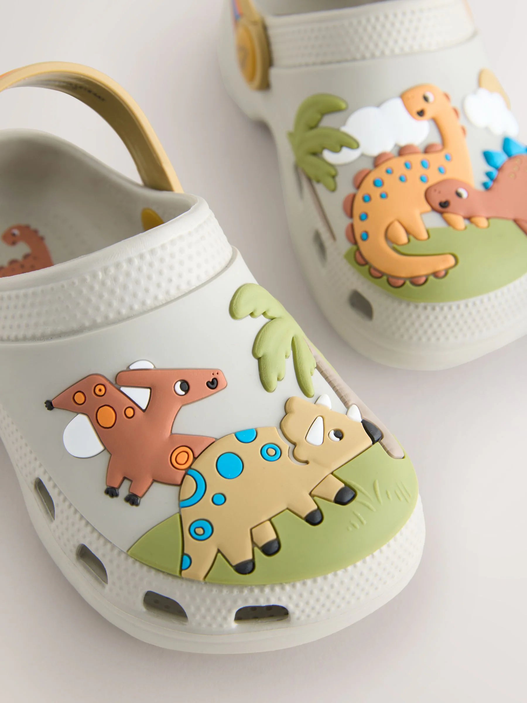 Neutral Dinosaur Print Scene Character Clogs
