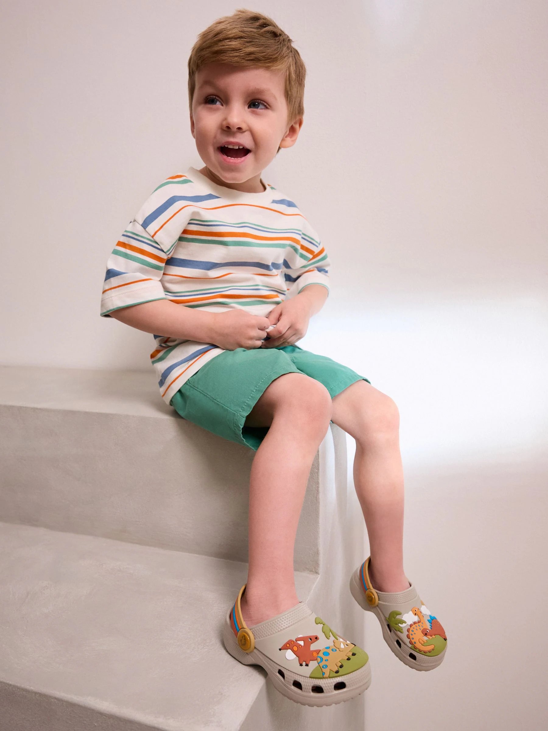 Neutral Dinosaur Print Scene Character Clogs